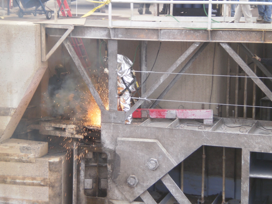 David Lynch, Pine Bluff Marine Terminal,  uses a gas-fed, magnesium rod to burn the old gudgeon pin in order to replace it. 