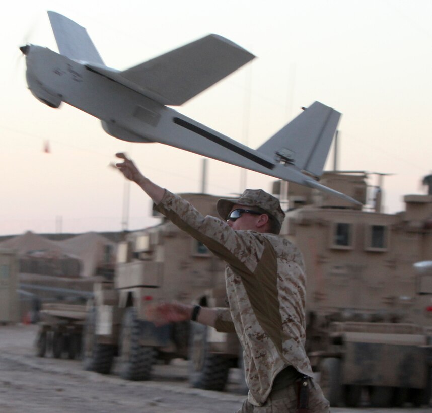 Lance Cpl. Andrew Herring launches the Puma during an operation at Patrol Base Boldak March 4. To operate, the Puma must be launched by hand. Herring is a member of Weapons Company with 2nd Battalion, 7th Marine Regiment. (Photo by Sgt. Bobby J. Yarbrough)