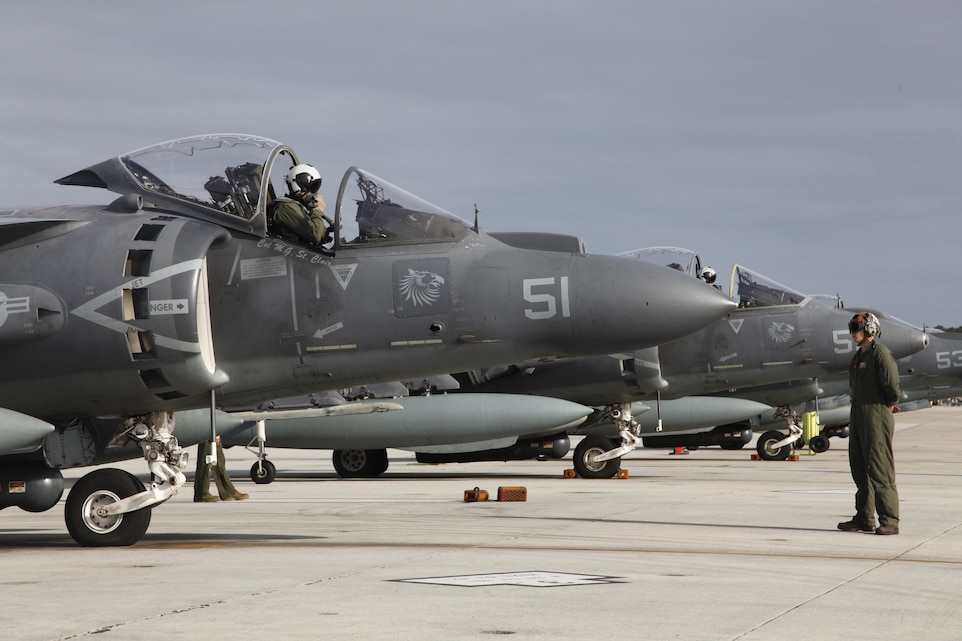 An AV-8B Harrier pilot with Marine Attack Squadron 231 sits in his aircraft and checks his equipment before departing Cherry Point March 11. Approximately 80 Marines and Sailors with VMA-231 departed Cherry Point to support operations with the 26th Marine Expeditionary Unit.