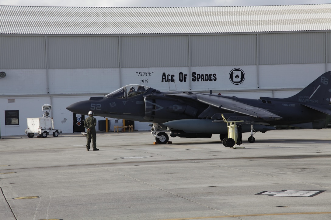 An AV-8B Harrier pilot with Marine Attack Squadron 231 sits in his aircraft and checks his equipment before departing Cherry Point March 11. Approximately 80 Marines and Sailors with VMA-231 departed Cherry Point to support operations with the 26th Marine Expeditionary Unit.