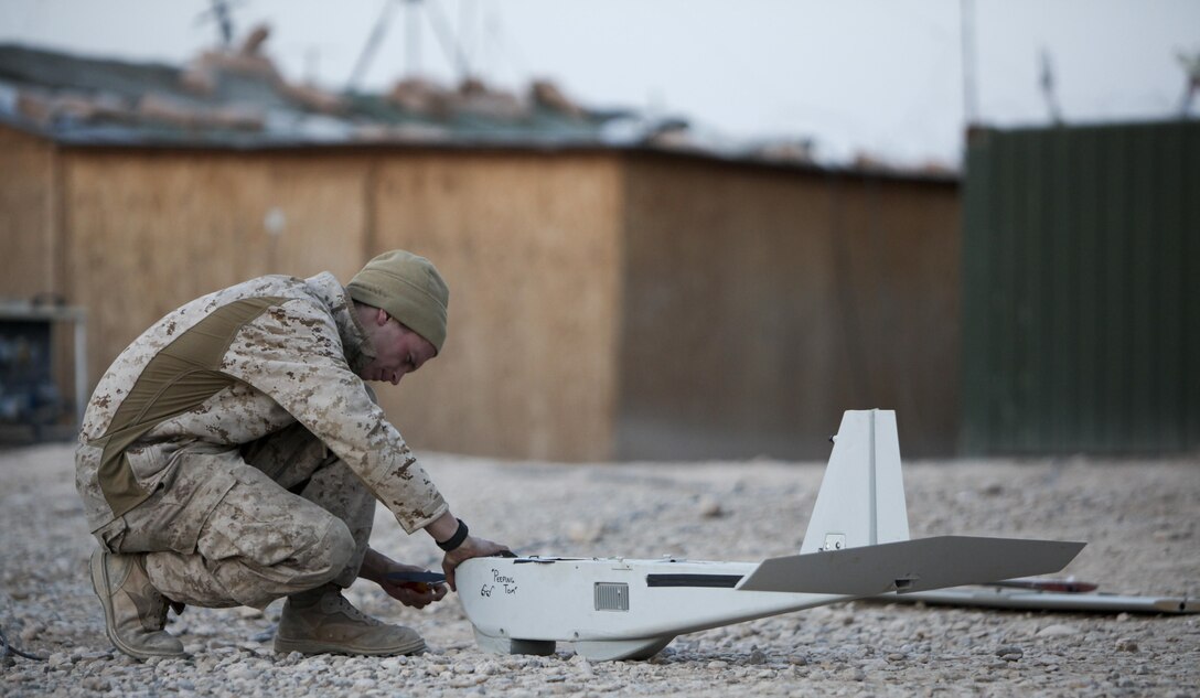 Lance Cpl. Andrew Herring repairs the propeller of the Puma. The aerial vehicle is designed to break apart on impact and the Marines must make an any repairs to the aircraft before they can relaunch the vehicle. Herring s a member of Weapons Company with 2nd Battalion, 7th Marine Regiment. (Photo by Sgt. Bobby J. Yarbrough)