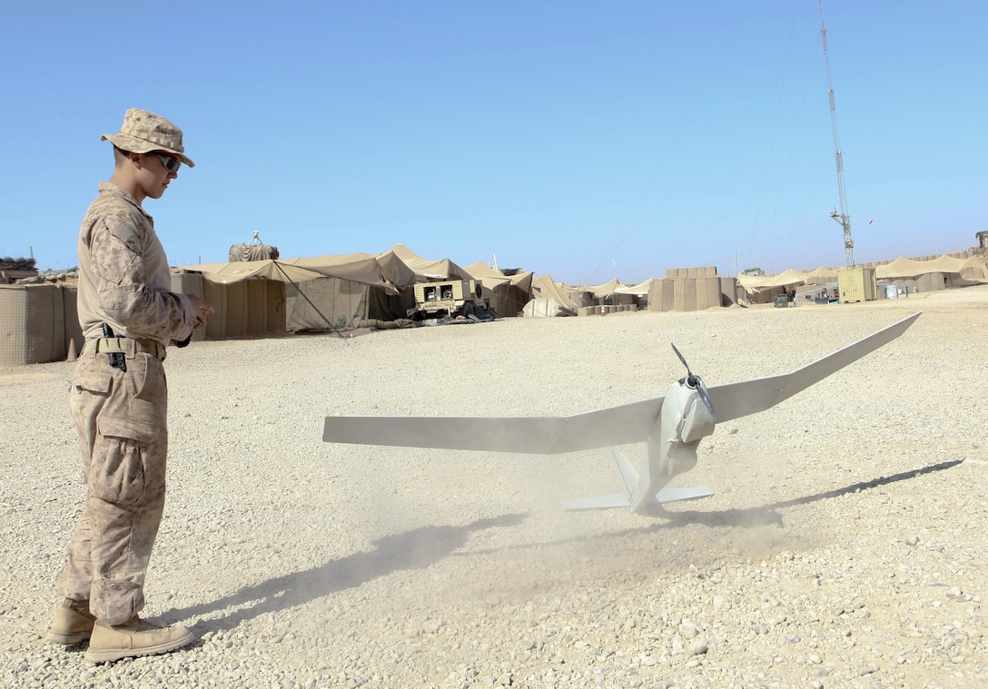 Lance Cpl. Scott Chase watches as the Puma lands following a 80 minute flight through Boldak, Afghanistan, March 6. Chase is one of four Puma operators with Weapons Company, 2nd Battalion, 7th Marine Regiment. (Photo by Sgt. Bobby J. Yarbrough)