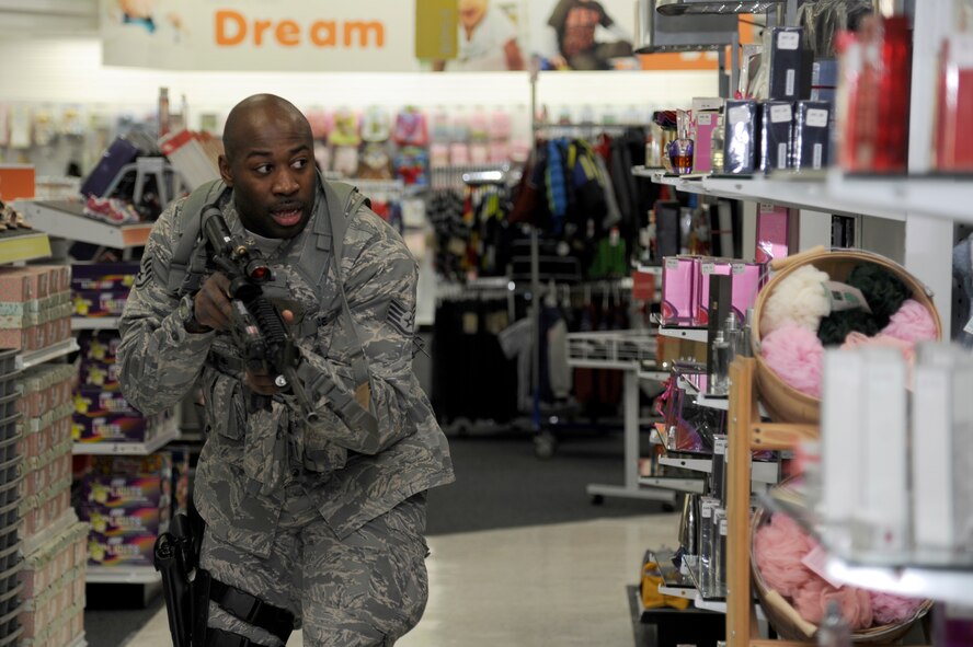 U.S. Air Force Staff Sgt. Michael Denson, 35th Security Forces Squadron, searches the Exchange for a simulated active shooter during the Pacific Air Forces High Risk Response Training course at Misawa Air Base, Japan, March 8, 2013. The course is designed to help prepare first responders to meet dangerous and unpredictable situations on a military installation.  (U.S. Air Force photo by Tech. Sgt. Marie Brown)