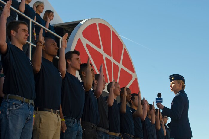 Maj. Susan Gardenhour, 368th Recruiting Squadron support flight commander, Hill Air Force Base, Utah, administers the Oath of Enlistment to U.S. Air Force delayed entry program members during the Kobalt Tools 400 at the Las Vegas Motor Speedway Mar. 10, 2013, in Las Vegas, Nev. Originally from Appomattox, Va., Gardenhour has been serving for 19 years. (U.S. Air Force photo by Airman 1st Class Christopher Tam)