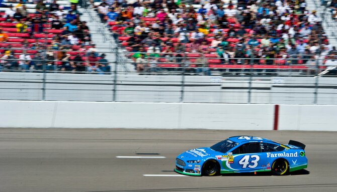 The No. 43 car, driven by Aric Almirola, races around the track during the Kobalt Tools 400 at the Las Vegas Motor Speedway Mar. 10, 2013, in Las Vegas, Nev. Almirola is a Cuban-American NASCAR Sprint Cup Series racecar driver, currently driving the No. 43 Smithfield Foods/United States Air Force/STP Ford  for Richard Petty Motorsports. (U.S. Air Force photo by Senior Airman Matthew Lancaster)