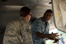 Staff Sgt. Curtis Betz, an F-15C Eagle crew chief, talks with a Republic of SIngapore Airman as they participate in an F-15 aircraft maintenance exchange between U.S. and Republic of Singapore Airmen during Cope Tiger 13 at Korat Royal Thai Air Force Base, Thailand, March 12, 2013. Though each country has a different model aircraft, the F-15 contributes to both nations' ability to project air power through Southeast Asia. Betz is assigned to the 18th Aircraft Maintenance Squadron at Kadena Air Base, Japan. More than 300 U.S. service members are participating in CT13, which offers an unparalleled opportunity to conduct a wide spectrum of large force employment air operations and strengthen military-to-military ties with two key partner nations, Thailand and Singapore. (U.S. Air Force photo/2nd Lt. Jake Bailey)