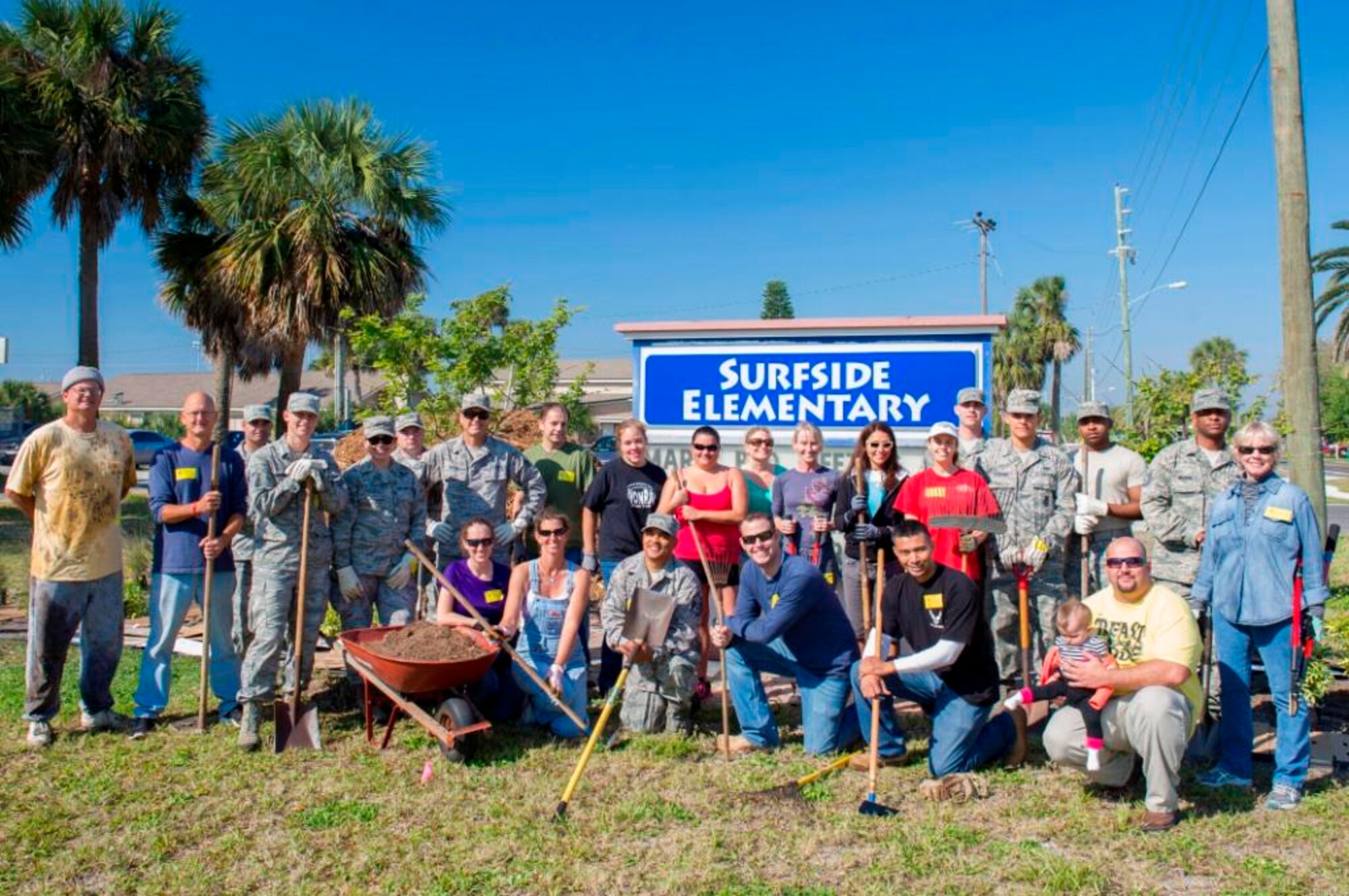 "I believe it really showed them the power of teamwork and maybe for some,
another side of the Air Force. I look forward to working with them again and
hope that we can continue to strengthen our community relationships through
partnerships like this," said Ms. Erika Maier, kneeling, second from left,
who heads the Surfside Elementary School's Beautification and Gardening
Committee. (U.S. Air Force Photo/Matthew Jurgens)