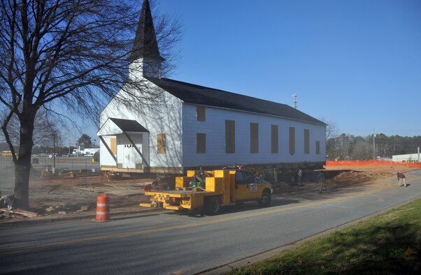 Dust is kicked up from the heavy construction equipment as they work to get the Dobbins Air Reserve Base chapel ready to be moved, Mar. 8. The Dobbins chapel is scheduled to be moved to the Army National Guard side of the base on Mar. 17. (U.S. Air Force photo/Senior Airman Elizabeth Van Patten)