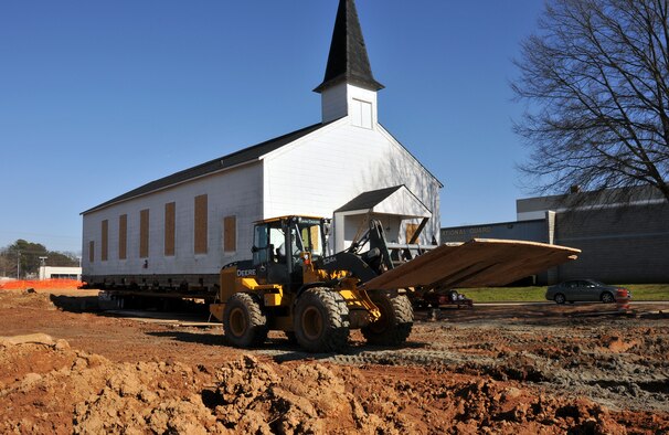 Personnel from Hercules House Movers work to create a path through the mud underneath the Dobbins Air Reserve Base chapel on Mar. 8, in preparation to move it to the Army National Guard side of the base. The Dobbins chapel is scheduled to be moved to the Army National Guard side of the base on Mar. 17. (U.S. Air Force photo/Senior Airman Elizabeth Van Patten)