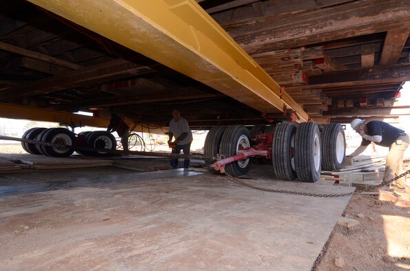 Moving crews use blocks of wood as chalks during the first movement of the Dobbins Air Reserve Base chapel, Mar. 8. (U.S. Air Force photo/Don Peek)