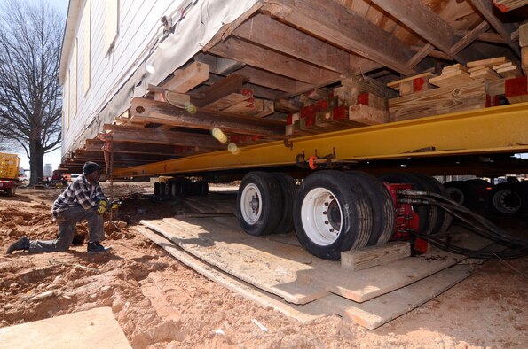 Moving crews inspect equipment and make preparations for the first movement of the Dobbins Air Reserve Base chapel, Mar. 8. (U.S. Air Force photo/Don Peek)