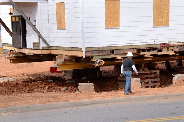 The Dobbins chapel rests on cribbing, Mar. 4, after personnel from Hercules House Movers have removed the foundation in preparation to move the chapel to the Army National Guard side of the base.  (U.S. Air Force photo/Brad Fallin)