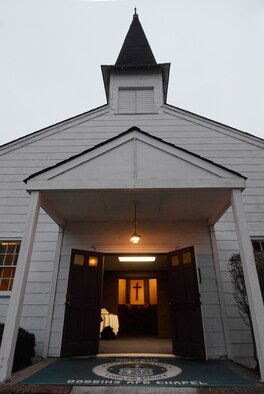 A familiar light glows in the early hours of a Sunday Unit Training Assembly welcoming those who attend the final morning services at the Dobbins Air Reserve Base Chapel, Jan 6. The Chapel, a familiar site to personnel who work on or pass through the front gate will soon see an empty space as the structure is slated to be moved. (U.S. Air Force photo/Don Peek)