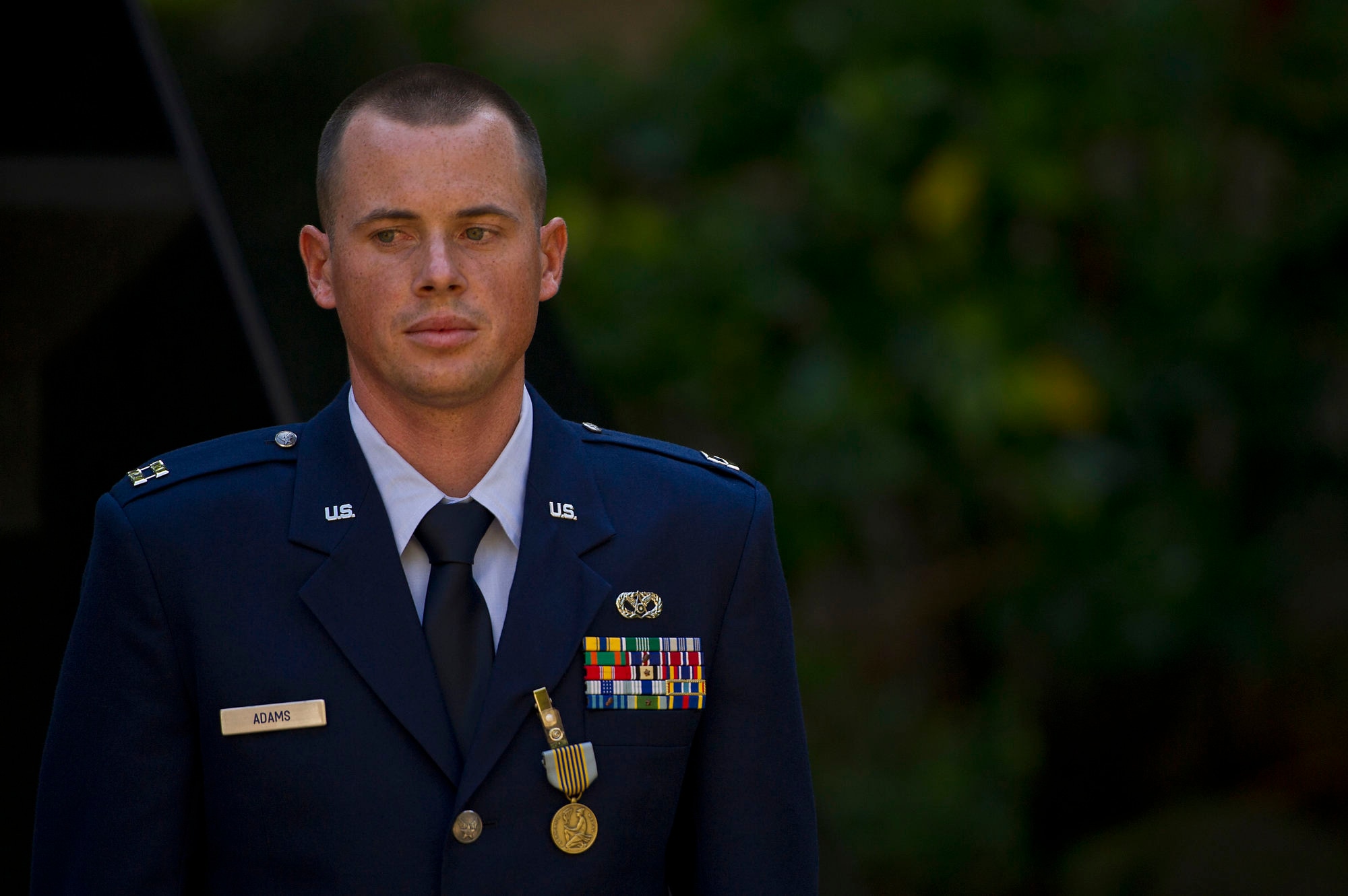 Capt. Matt Adams, 647th Air Base Group, was presented the Airman's Medal for heroism involving voluntary risk of life at Nauyaca Waterfalls, Platanillo, Costa Rica, Jan. 1, 2011.  On that date, Adams witnessed another officer fall from a 25-foot cliff, landing on the rocks below and hitting his head and back before sinking to the bottom of a pool below the waterfall.  With complete disregard for his own safety, he dove from the same cliff and over the boulders below to swim down 20 feet to the bottom of the pool where he located the unconscious victim and transported him to shore. (Department of Defense photo by U.S. Air Force Tech. Sgt. Michael R. Holzworth/Released)