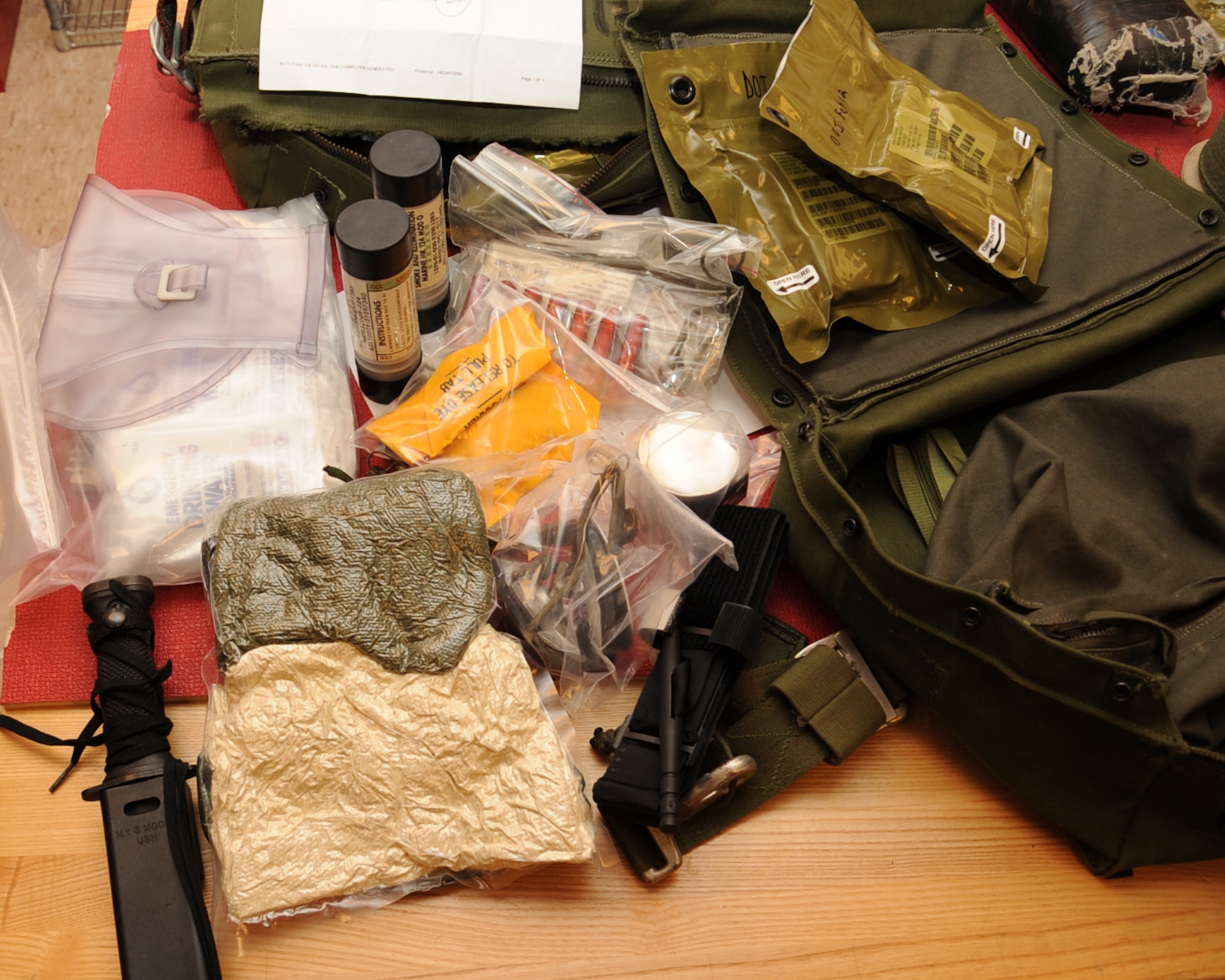 Items found in a soft survival kit sit on a table on Barksdale Air Force Base, La., March 13. The 2nd Operation Support Squadron Aircrew Flight Equipment flightline section is in charge of installing and inspecting all survival kits on the B-52H Stratofortress.  (U.S. Air Force photo/Senior Airman Sean Martin)