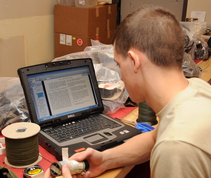 Airman 1st Class Michael Fields, 2nd Operation Support Squadron Aircrew Flight Equipment, looks through a technical order on Barksdale Air Force Base, La., March 13. A TO is used to make sure steps are not missed when working on or repairing an item. (U.S. Air Force photo/Senior Airman Sean Martin)