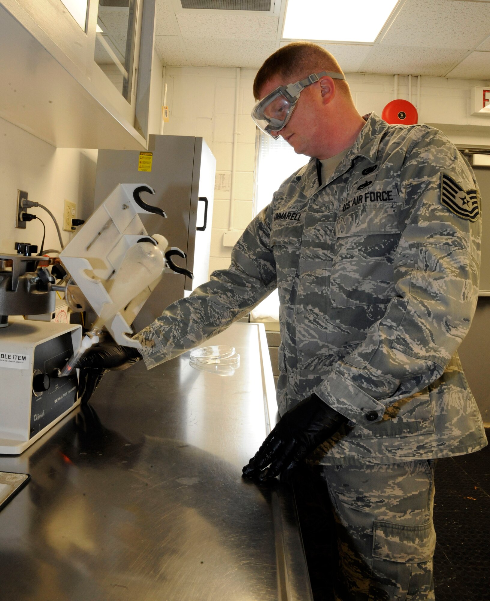 Tech. Sgt. Eric Summarell, 403rd Logistics Readiness Squadron fuels laboratory technician, observes fuel on a shaker on Barksdale Air Force Base, La., March 13. The fuels laboratory tests and samples a variety of different fuels ranging from diesel, jet and missile fuel, and test for contaminants and foreign particles. (U.S. Air Force photo/Airman 1st Class Andrew Moua)