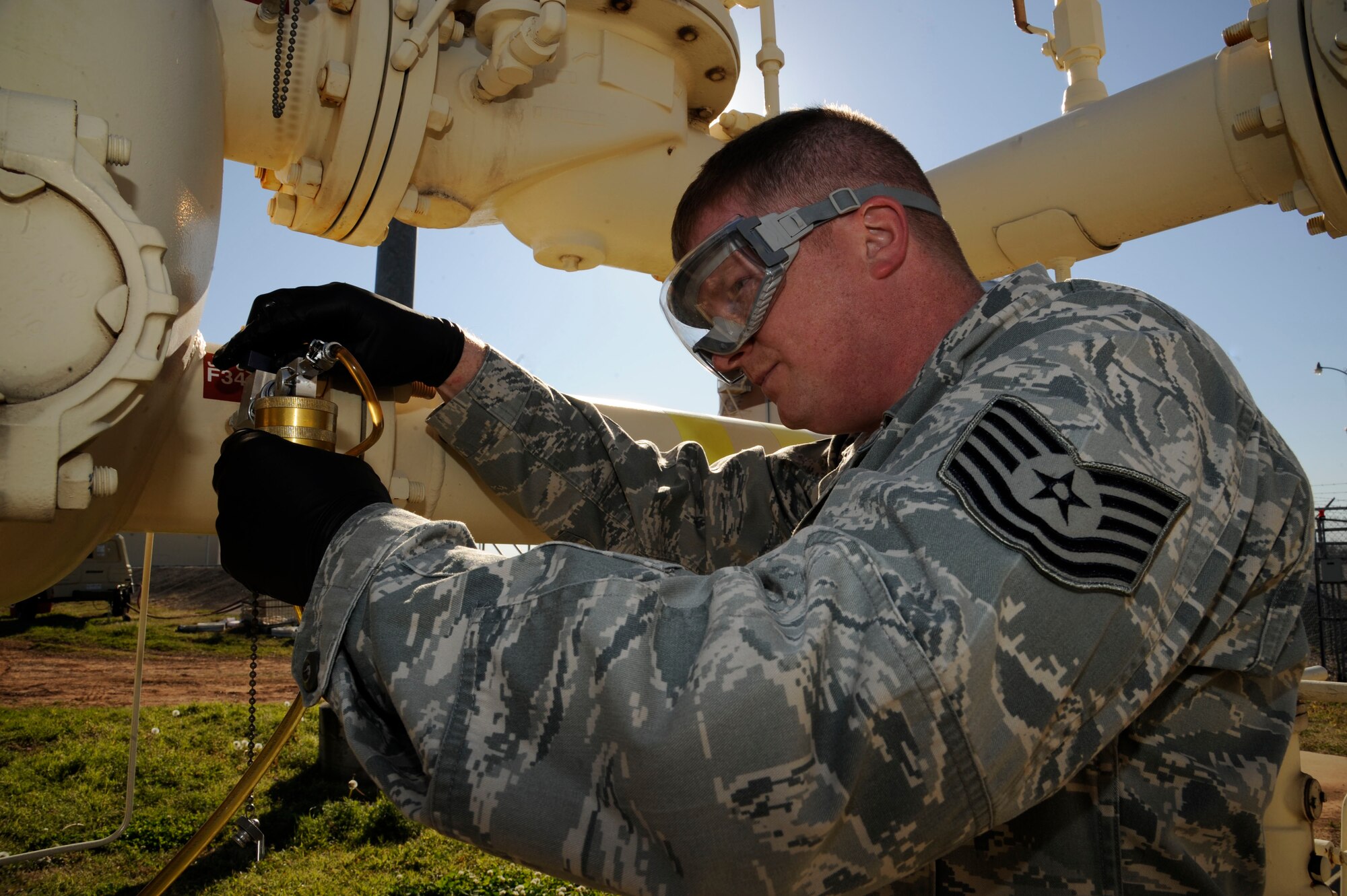 Tech. Sgt. Eric Summarell, 403rd Logistics Readiness Squadron fuels laboratory technician, retrieves a fuel sample for testing on Barksdale Air Force Base, La., March 13. The fuels laboratory tests and samples a variety of different fuels ranging from diesel, jet and missile fuel, and test for contaminants and foreign particles. (U.S. Air Force photo/Airman 1st Class Andrew Moua)