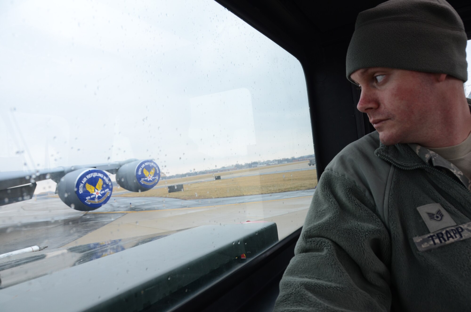 Staff Sgt. Mark Trapp, a crew chief for the 906th Air Refueling Squadron, watches while he maneuvers to reattach to the front of a KC-135R Stratotanker on Scott Air Force Base, Ill., March 5, 2013. After reattaching to the aircraft, Trapp will position the aircraft on the flightline where it will be inspected prior to takeoff. The 906 ARS is an Active Associate squadron of the 126th Air Refueling Wing, Illinois Air National Guard, and is comprised of Active Duty Air Force members. (National Guard photo by Airman 1st Class Elise Stout)