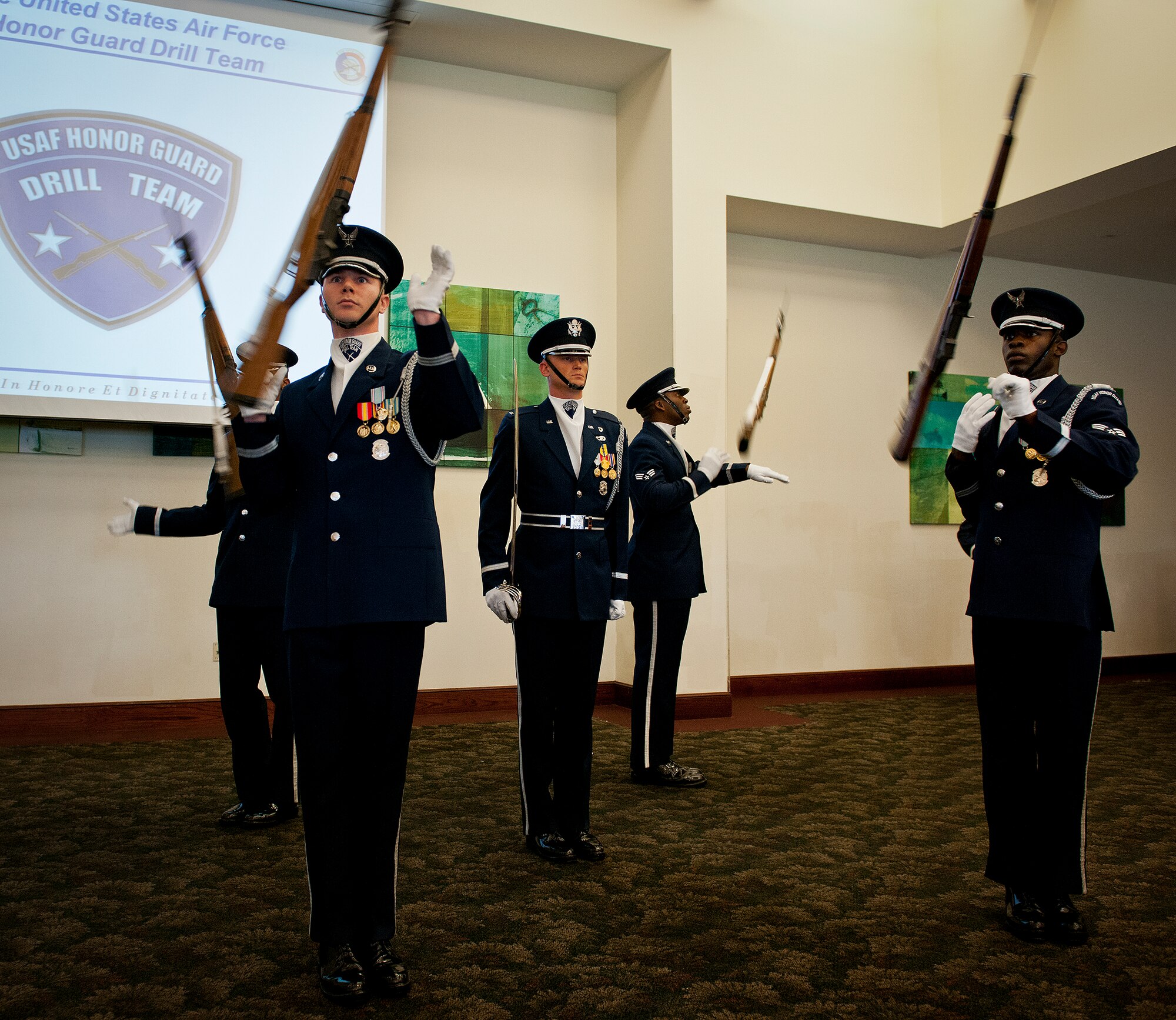 Members of the Air Force Honor Guard perform a rifle routine March 12 at Eglin Air Force Base, Fla.  The team visited the base to highlight their program and find interested Airmen who may be interested in joining.  After the performance, the group spoke about the requirements to become a member and answered questions from the audience.  (U.S. Air Force photo/Samuel King Jr.)