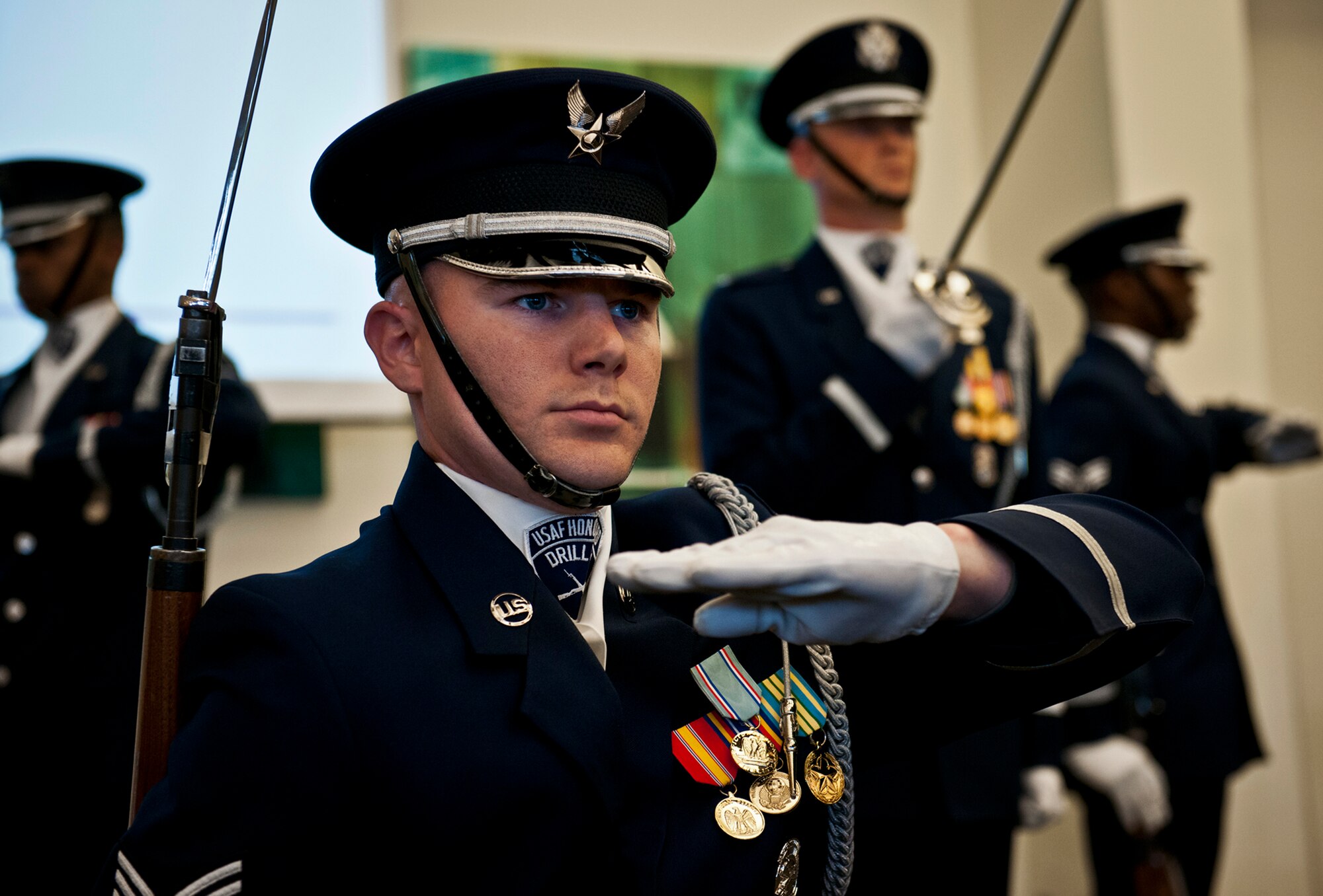Members of the Air Force Honor Guard perform a rifle routine March 12 at Eglin Air Force Base, Fla.  The team visited the base to highlight their program and find interested Airmen who may be interested in joining.  After the performance, the group spoke about the requirements to become a member and answered questions from the audience.  (U.S. Air Force photo/Samuel King Jr.)
