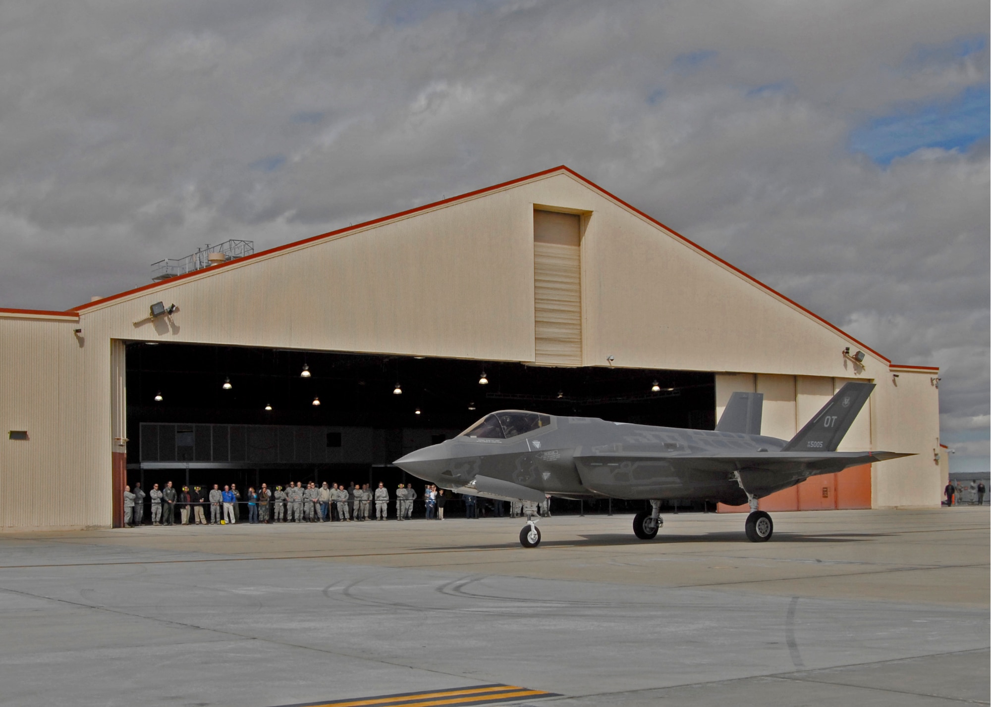 Members of the 461st Flight Test Squadron and Joint Strike Fighter Integrated Test Force watch the arrival of one of two F-35As to begin operational testing March 6. Team members from Air Combat Command’s 31st Test and Evaluation Squadron, a tenant unit here, will determine how to best tactically operate the F-35A conventional takeoff and landing variant of the fifth-generation fighter. (U.S. Air Force photo by Laura Mowry)