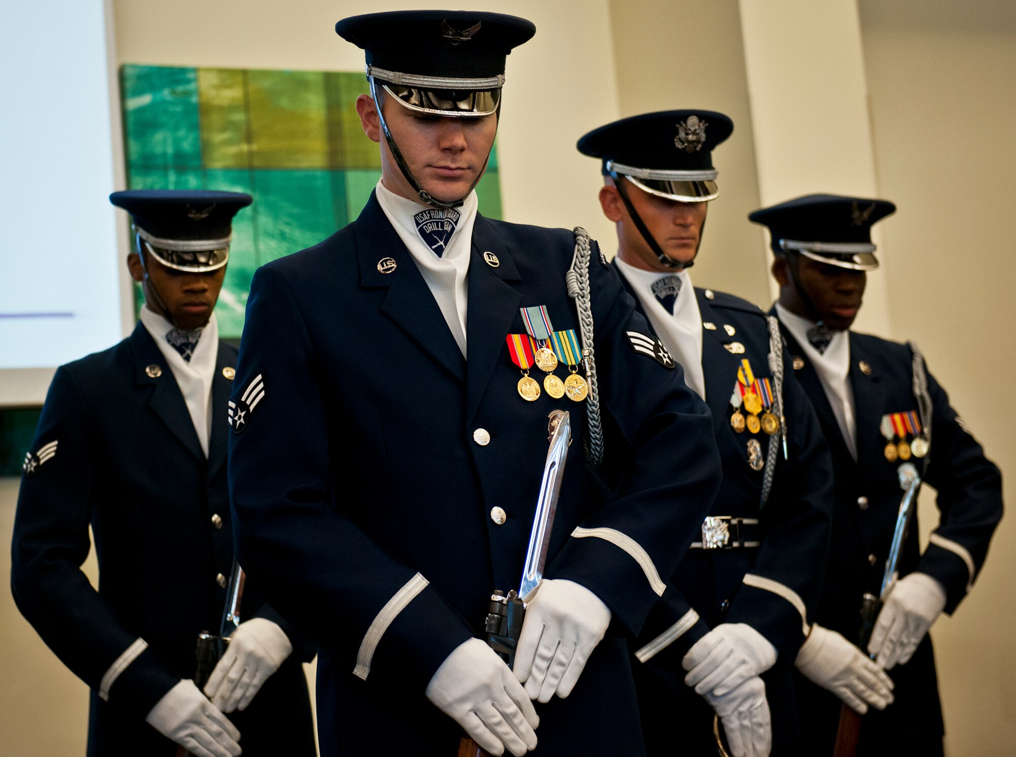 Members of the Air Force Honor Guard perform a rifle routine March 12 at Eglin Air Force Base, Fla.  The team visited the base to highlight their program and find interested Airmen who may be interested in joining.  After the performance, the group spoke about the requirements to become a member and answered questions from the audience.  (U.S. Air Force photo/Samuel King Jr.)