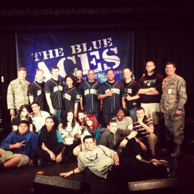 Blue Aces hang out with young fans after a school outreach show.
