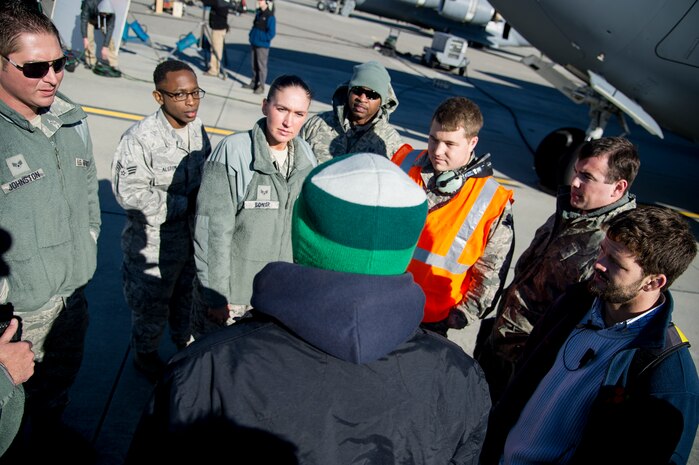 Film crew members of the Army Wives television show brief Airmen on their role as “extras” in an upcoming scene Feb. 28, 2013, at Joint Base Charleston - Air Base, S.C. The roles of the Airmen, from the 437th Aircraft Maintenance Squadron, helped contribute to the realism of the scene. Army Wives tells the story of four women and one man who are brought together by their common bond - they all have military spouses. The series is based on the book "Under the Sabers: The Unwritten Code of Army Wives" by Tanya Biank and is produced by ABC Television Studio and The Mark Gordon Company. (U.S. Air Force photo/ Staff Sgt. Rasheen Douglas)