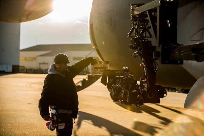 An Army Wives television crewmember uses a clapperboard, a tool used to sync sound and film and mark specific scenes, during an on-location filming session Feb. 28, 2013, at Joint Base Charleston - Air Base, S.C. Army Wives tells the story of four women and one man who are brought together by their common bond - they all have military spouses. The series is based on the book "Under the Sabers: The Unwritten Code of Army Wives" by Tanya Biank and is produced by ABC Television Studio and The Mark Gordon Company. (U.S. Air Force photo/ Senior Airman George Goslin)