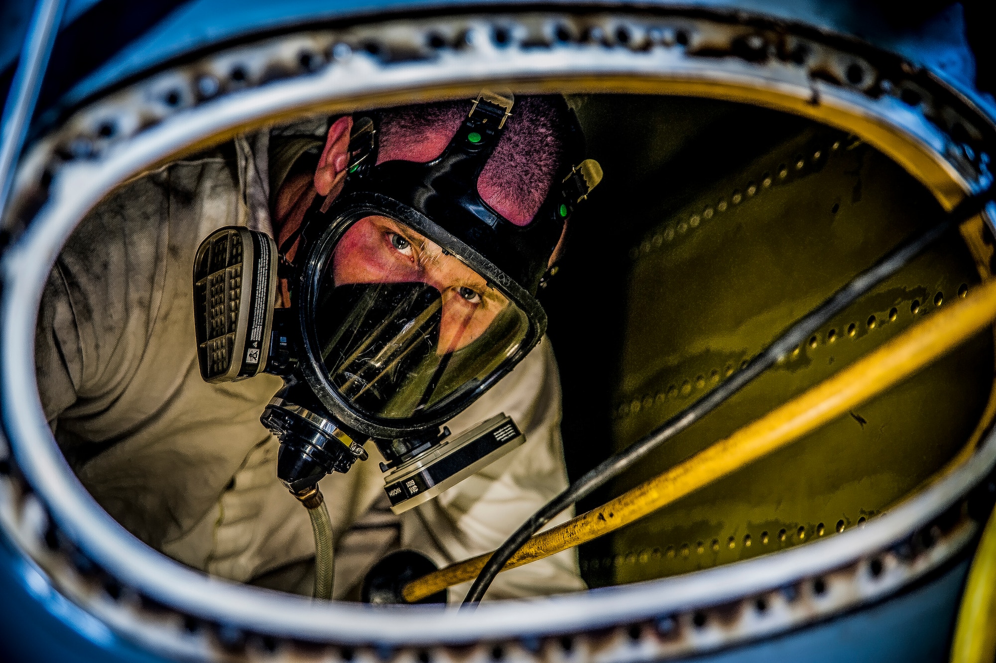 Airman 1st Class Nicholas McKinney, 437th Maintenance Squadron aircraft fuels systems apprentice, prepares to be extracted from the inside of a C-17 Globemaster III fuel tank during a training exercise March 7, 2013, at Joint Base Charleston – Air Base, S.C.  Fuel System Repair Airmen maintain the fuel cells and tanks by removing, repairing and installing the cells and tanks The Airmen also clean the cells and tanks, inspect for corrosion, cell deterioration, fungus and foreign objects. (U.S. Air Force photo / Airman 1st Class Tom Brading)