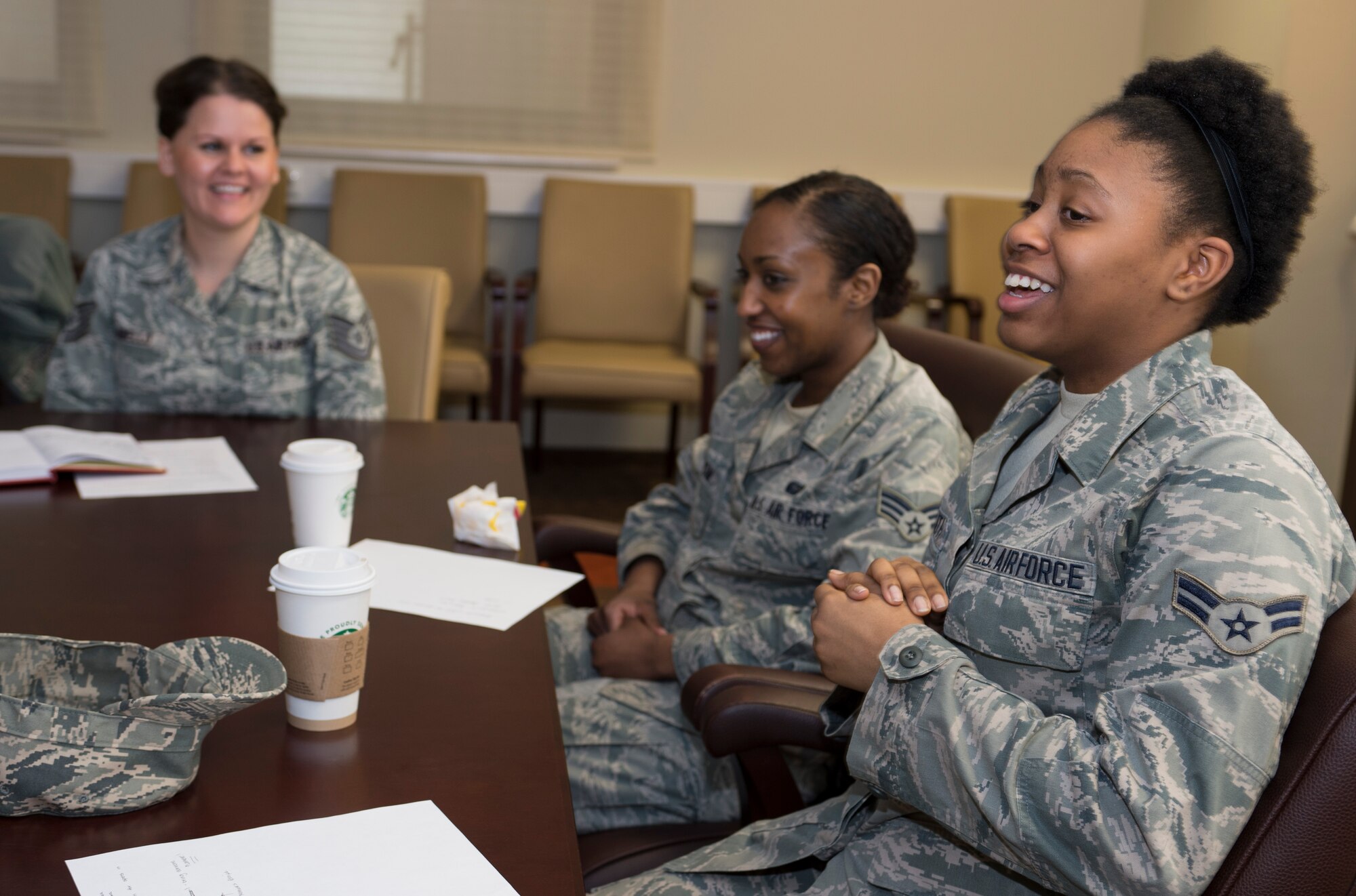 SPANGDAHLEM AIR BASE, Germany – Airman 1st Class Dominique Gilbreath, 52nd Medical Support Squadron outpatient records technician, shares with the SpangDamen women’s success forum what she enjoyed about the dorm dinner they held at the Spangdahlem conference room, March 7, 2013. Spangdamen hosted a make your own pizza night in which Airmen and senior NCOs discussed various topics ranging from professional to personal. (U.S. Air Force photo by Senior Airman Natasha Stannard/Released)