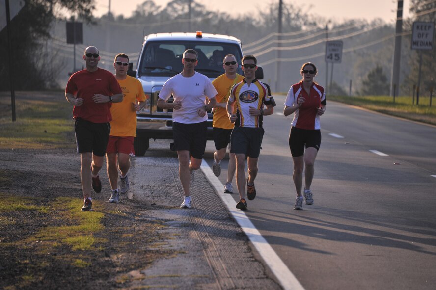 A team from Air Command and Staff College runs one leg of the ACSC Warrior Relay from Maxwell Air Force Base in Montgomery, Ala., to MacDill Air Force Base in Tampa, Fla., March 8. During the course of the day, teams endured multiple legs with few hours separating their effort to reach United States Special Operations Command. (U.S. Air Force photo by Airman 1st Class William Blankenship) 