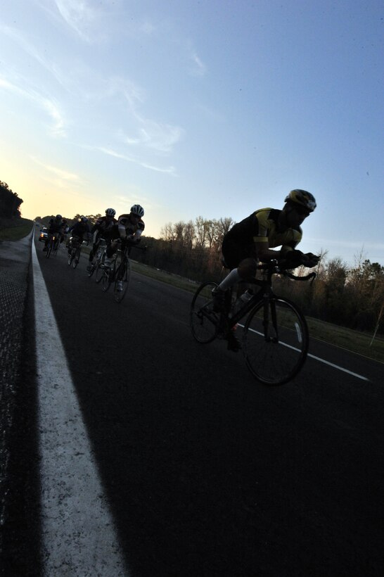 A team from Air Command and Staff College cycles through one leg of the ACSC Warrior Relay from Maxwell Air Force Base in Montgomery, Ala., to MacDill Air Force Base in Tampa, Fla., March 8. The 63 participants departed from Maxwell, traveling in shifts to ensure a team was always on the road.  Each shift varied from 3-mile runs to 20- mile bike and run combinations. (U.S. Air Force photo by Airman 1st Class William Blankenship) 