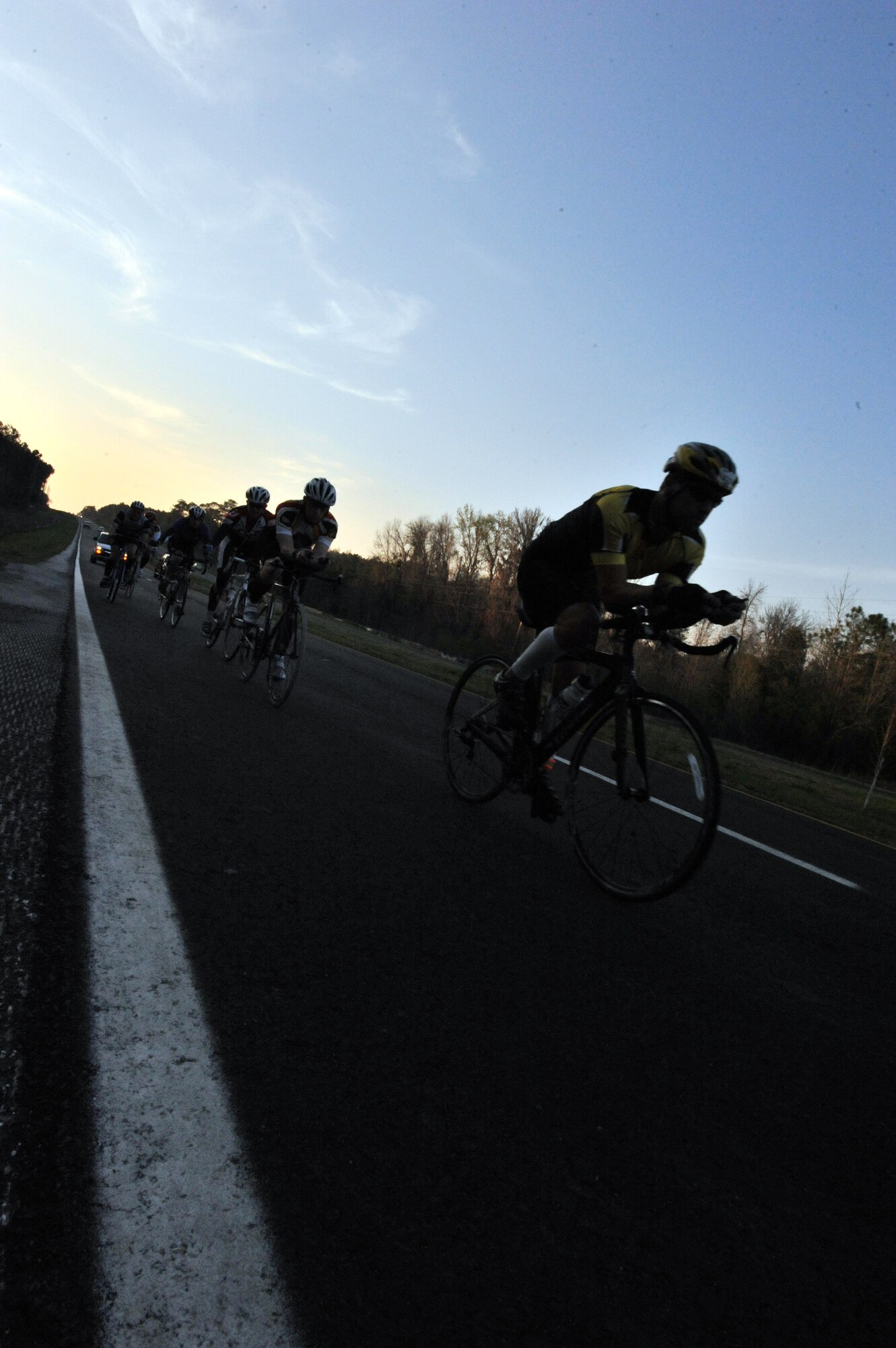 A team from Air Command and Staff College cycles through one leg of the ACSC Warrior Relay from Maxwell Air Force Base in Montgomery, Ala., to MacDill Air Force Base in Tampa, Fla., March 8. The 63 participants departed from Maxwell, traveling in shifts to ensure a team was always on the road.  Each shift varied from 3-mile runs to 20- mile bike and run combinations. (U.S. Air Force photo by Airman 1st Class William Blankenship) 