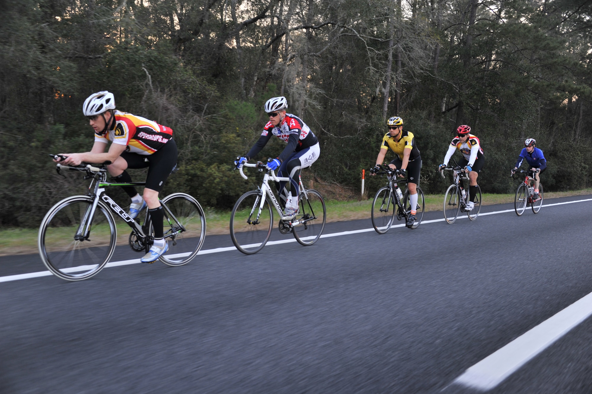 A team from Air Command and Staff College cycles through one leg of the ACSC Warrior Relay from Maxwell Air Force Base in Montgomery, Ala., to MacDill Air Force Base in Tampa, Fla., March 8. Teams were made up of ACSC students and faculty and raised money for Special Ops Warrior Foundation. (U.S. Air Force photo by Master Sgt. Michael Voss) 
