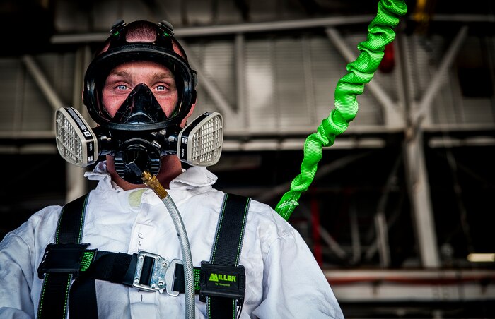 Airman 1st Class Nicholas McKinney, 437th  Maintenance Squadron aircraft fuels systems apprentice, finishes suiting up in safety gear before descending inside a C-17 Globemaster III fuel tank, March 7, 2013, at Joint Base Charleston – Air Base, S.C.  Fuel System Repair Airmen maintain the fuel cells and tanks by removing, repairing and installing the cells and tanks. The Airmen also clean the cells and tanks, inspect for corrosion, cell deterioration, fungus and foreign objects. (U.S. Air Force photo / Airman 1st Class Tom Brading)