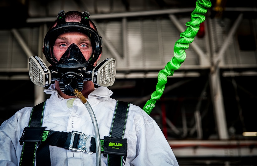 Airman 1st Class Nicholas McKinney, 437th  Maintenance Squadron aircraft fuels systems apprentice, finishes suiting up in safety gear before descending inside a C-17 Globemaster III fuel tank, March 7, 2013, at Joint Base Charleston – Air Base, S.C.  Fuel System Repair Airmen maintain the fuel cells and tanks by removing, repairing and installing the cells and tanks. The Airmen also clean the cells and tanks, inspect for corrosion, cell deterioration, fungus and foreign objects. (U.S. Air Force photo / Airman 1st Class Tom Brading)