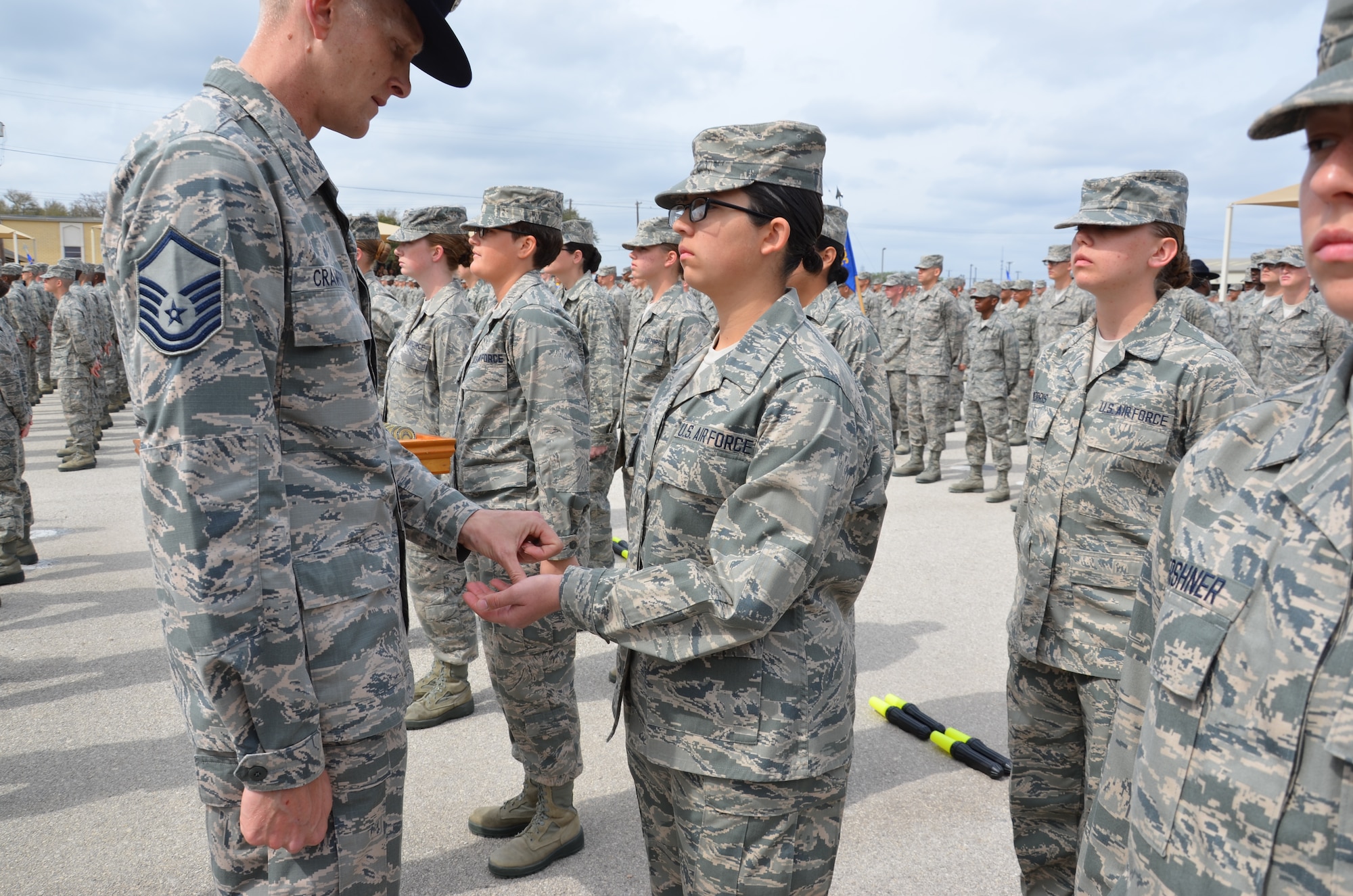 Trainee Kaycee J. Franco, Basic Military Training Flight 190, Joint Base San Antonio-Lackland, Texas, receives her Airman’s Coin from Master Sgt. Christopher Crawford, a military training instructor assigned to the 326th Training Squadron, JBSA-Lackland, March 7, 2013.  The Airman’s Coin Ceremony is considered to be one of the most important events during a person’s military career.  After a trainee receives their Airman Coin, they can officially be called “Airman.”  (U.S. Air Force photo by Dona Fair)