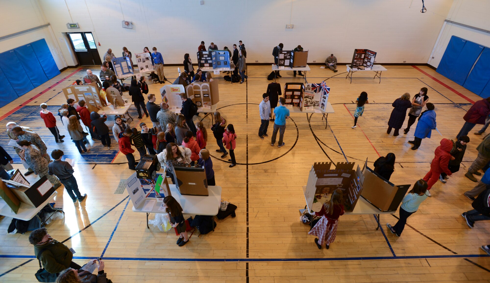 ROYAL AIR FORCE LAKENHEATH, England - Students, judges and participants browse exhibits during the 2nd Annual Isles District National History Day Showcase Feb. 28, 2013. Approximately 130 students from six Department of Defense Dependents Schools Isles District schools participated in the showcase. (U.S. Air Force photo by Staff Sgt. Stephen Linch)