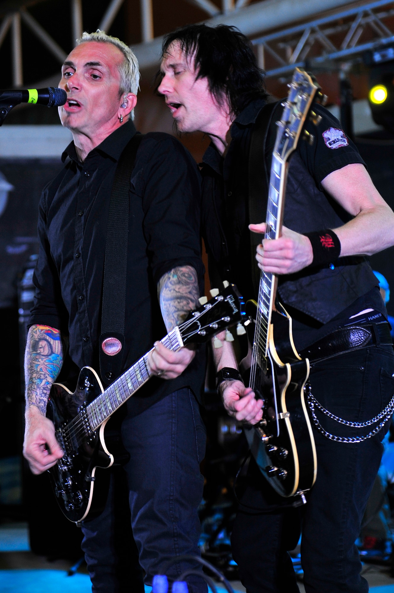 Art Alexakis, lead vocals, and Dave French, back-up vocals and guitar, of the band Everclear perform a concert of their greatest hits for the men and women of the 380th Air Expeditionary Wing at an undisclosed location in Southwest Asia Mar. 10, 2013. Band members spent the day touring the installation and meeting Airmen and Soldiers, thanking them for their sacrifice and service. (U.S. Air Force photo by Tech. Sgt. Christina M. Styer/Released)