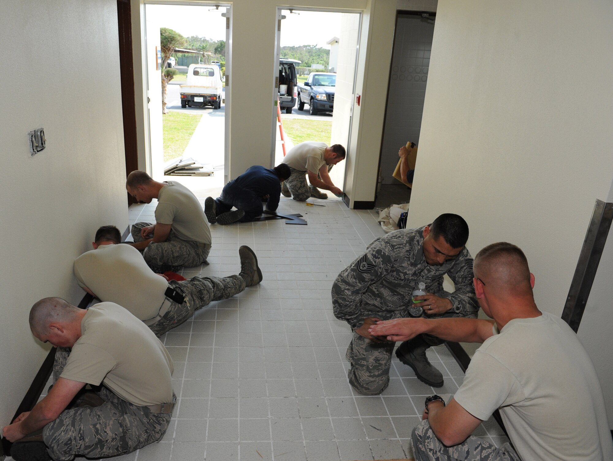 U.S. Air Force Tech. Sgt. Erick Lizarraga, 18th Civil Engineer Squadron structural craftsman, works with his team on constructing a special operations group human performance center on Kadena Air Base, Japan, March 7, 2013. The center is one of the many projects Lizarraga has contributed to along with community involvement, which led to him achieving the FAPAC Military Meritorious Service Award for 2012. (U.S. Air Force photo/Airman 1st Class Keith A. James)