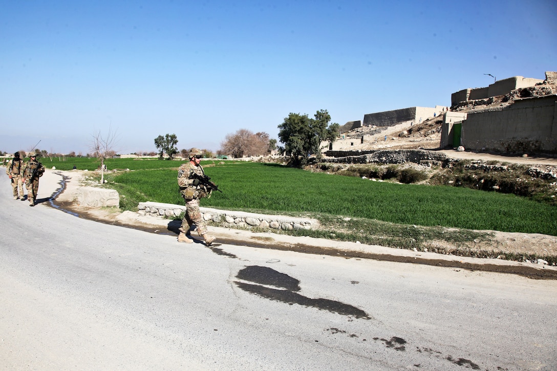 U.S. Army Lt. Col. Peter Wilhelm, right, provides security while leading a patrol in Jaba Village in the Boti Kot district in Afghanistan's Nangarhar province, March 4, 2013. Wilhelm is deputy commander of the 101st Airborne Division's 1st Battalion, 327th Infantry Regiment, 1st Brigade Combat Team.
