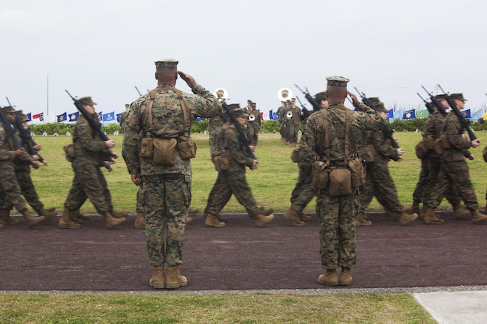 U.S. Marines with Combat Logistics Regiment 35 (CLR-35) conduct a pass and review during the change of command ceremony on Camp Kinser, Okinawa, Japan, Feb. 22, 2013. Col. Anthone Wright took over command of CLR-35 for Col. Ronald Jones. 