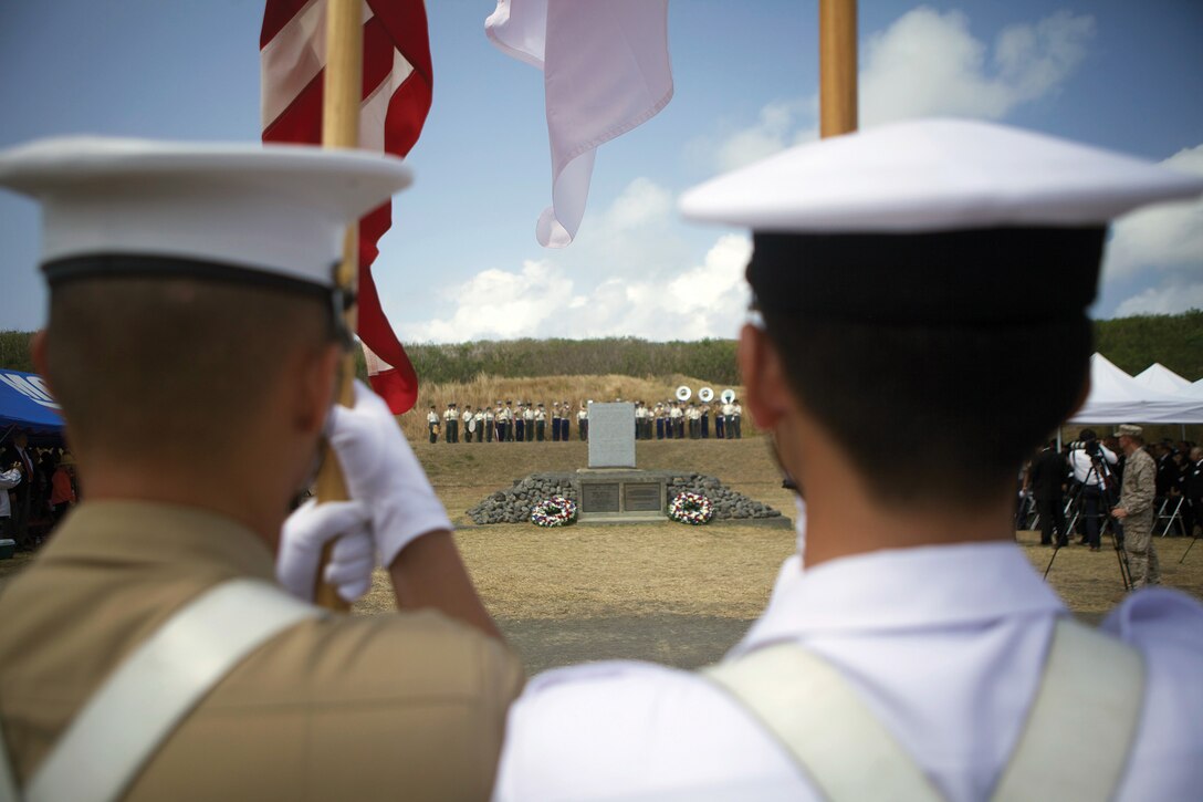 A combined Japan-U.S. color guard prepares to retire the colors during the reunion of honor ceremony March 13 at Iwo To, Japan. The ceremony commemorated the 68th anniversary of the Battle of Iwo Jima, during which approximately 30,000 Japanese and American service members lost their lives. Japan and U.S. veterans of the battle, along with active-duty service members, came together to honor those who fought valiantly.
