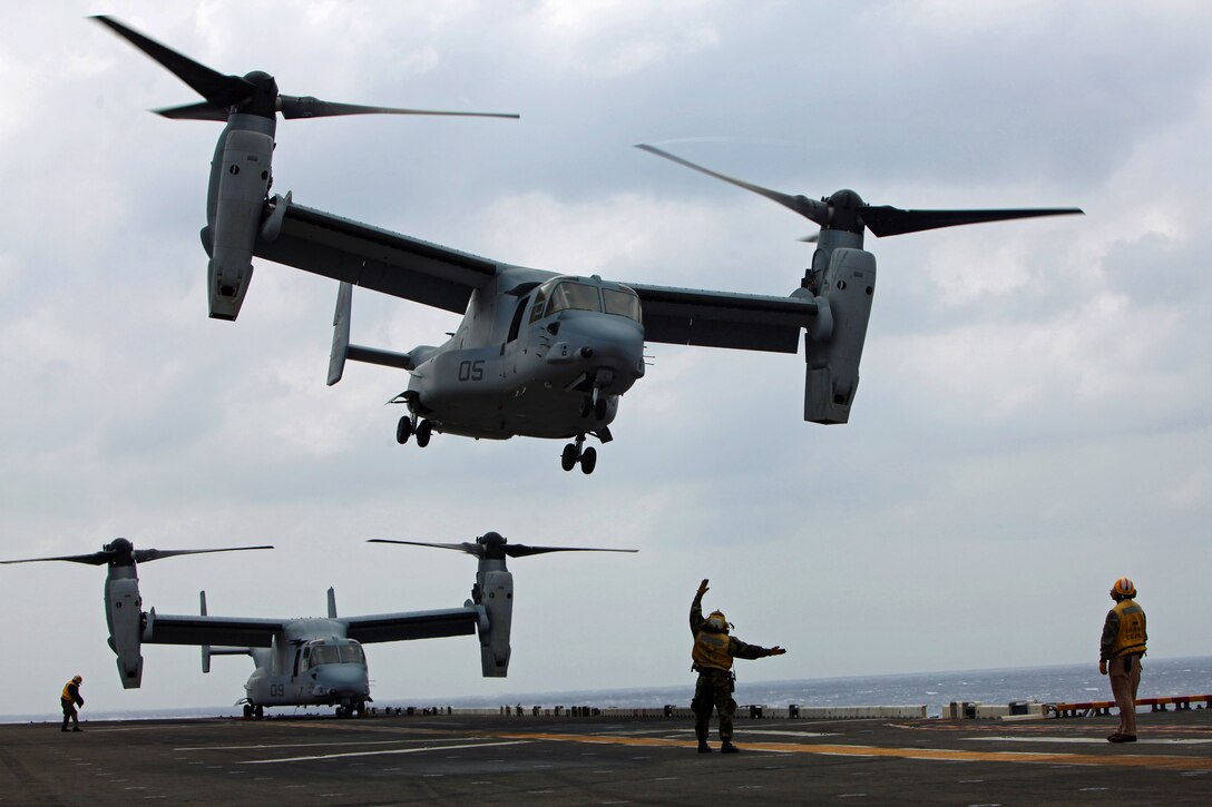 An aviation boatswain’s mate (handling) with Amphibious Squadron 11 guides an MV-22 Osprey helicopter from Marine Medium Tiltrotor Squadron 265 on to the flight deck here, March 14. As one of the rotating squadrons of the 31st Marine Expeditionary Unit, VMM-265 must maintain proficiency in landing on the deck of a moving ship. The 31st MEU is currently deployed with Amphibious Squadron 11, conducting their semi-annual Certification Exercise. CERTEX is designed to test the MEU’s wide range of capabilities, ensuring their readiness for any contingency that may occur in the region. The 31st MEU is the Marine Corps’ force in readiness for the Asia-Pacific region and the only continuously forward-deployed MEU.