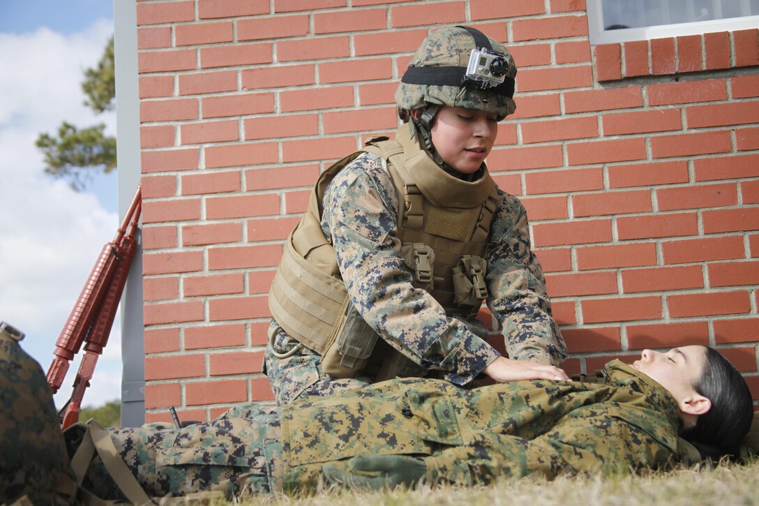 Cpl. Stephanie Abelino, a warehouse clerk with Marine Aircraft Group 14, performs CPR on a victim with a simulated injury, during a combat lifesaver course aboard Marine Corps Auxiliary Landing Field Bogue March 6.