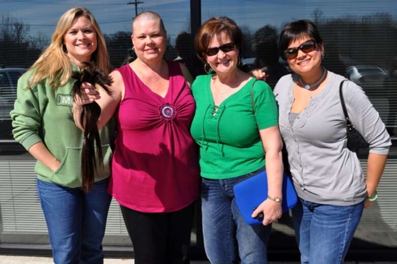 Sharon Crusenberry (second from left) joins her Marine Corps System Command and Program Executive Officer Land Systems supporters after she volunteered to have her head shaved March 10 at Paddy's Steakhouse and Pub in Stafford, Va. Crusenberry, who supports the Medium/Heavy Tactical Vehicles program under PEO LS, participated in the St. Baldrick’s Foundation head-shaving event to help fight childhood cancer. Her supporters from left are Kristelle Muterspaw, Marine Air-Ground Task Force Command, Control and Communications; Shirley Shanahan, Ground-Based Air Defense and Ground/Air Task-Oriented Radar; and Marti Ramsey, Infantry Weapons Systems. 