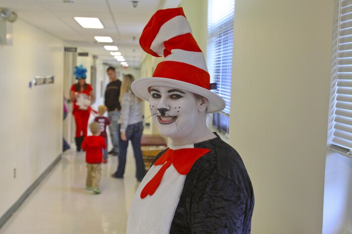 The Cat in the Hat. Thing 1, Thing 2 and Marine Corps Air Station New River Library employees greeted service member and their family to the Read Across America event held at the library, Mar. 1.  Members of Marine Corps Community Services and Coastal Carolina Community College read excerpts of Dr. Seuss books to more than 130 people who all read along as the book as displayed on a projector screen. Read Across America is held every year on the school date closest to Dr. Seuss’ birthday, Mar. 2, to promote reading in children of all ages.