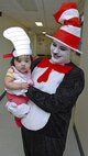The Cat in the Hat. Thing 1, Thing 2 and Marine Corps Air Station New River Library employees greeted service member and their family to the Read Across America event held at the library, Mar. 1.  Members of Marine Corps Community Services and Coastal Carolina Community College read excerpts of Dr. Seuss books to more than 130 people who all read along as the book as displayed on a projector screen. Read Across America is held every year on the school date closest to Dr. Seuss’ birthday, Mar. 2, to promote reading in children of all ages.